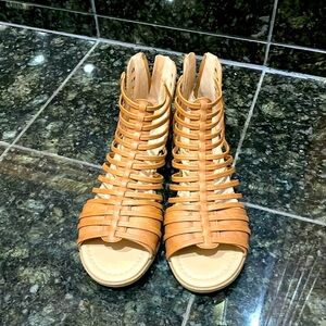 Light brown gladiator sandals.
